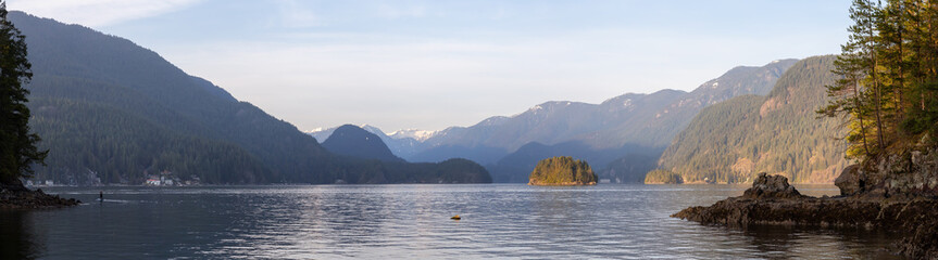 Beautiful Panoramic View of the Canadian Landscape during a vibrant winter sunset. Hike on Jug Island Trail in Belcarra, Vancouver, British Columbia, Canada. Nature Panorama Background