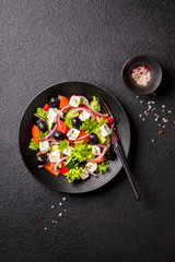 Greek salad of fresh vegetables, olives and feta. Traditional Mediterranean food.