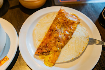 Close up shot of a Mexician style egg wrap with Taco