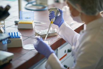 scientict making research in lab analyzing a new virus. corona virus concept