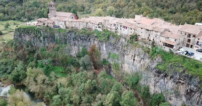 Aerial view of Castellfollit de la Roca, medieval Catalan hamlet on cliff on autumn day