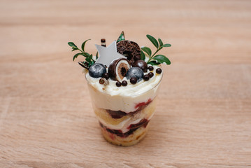 A beautiful and mouth-watering close-up trifle on a table with space for a signature. Cake