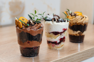 Very beautiful and appetizing traily closeup on table with space for signatures. Cake