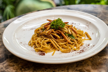 spaghetti dish prepared with larvae