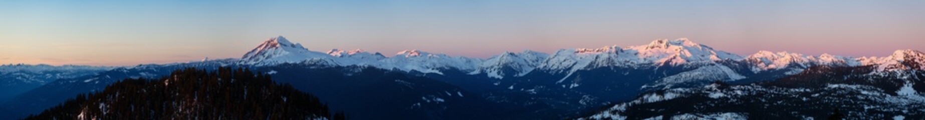 Beautiful Aerial Panoramic View of Canadian Mountain Landscape during a colorful sunset. Taken in Squamish, North of Vancouver, British Columbia, Canada. Nature Background Panorama