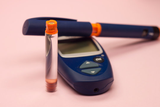 collage of insulin and glucometer on a pink background