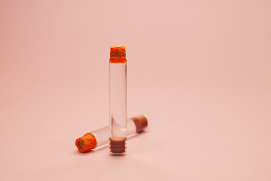 insulin cartridge on a pink background