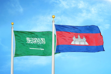 Saudi Arabia and Cambodia  two flags on flagpoles and blue cloudy sky