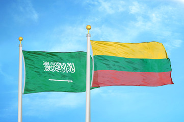 Saudi Arabia and Lithuania two flags on flagpoles and blue cloudy sky