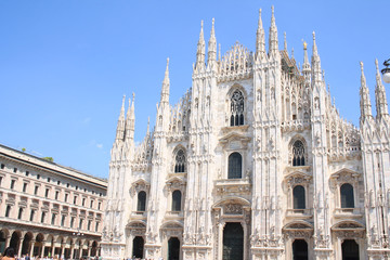 Fototapeta na wymiar The amazing Milan Cathedral, Duomo di Milano, the largest Gothic cathedral in the world and Vittorio Emanuele gallery in Square Piazza Duomo, Italy