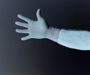 Hands of a man protected from coronavirus. White, latex gloves Protect your palm from infections, viruses, germs. Skin Isolation Symbol protection against the danger of infection. Obstruction, a barri