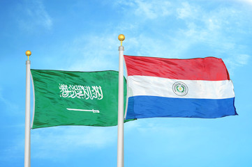 Saudi Arabia and Paraguay two flags on flagpoles and blue cloudy sky