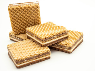 delicious hazelnut cream filled wafers on white background