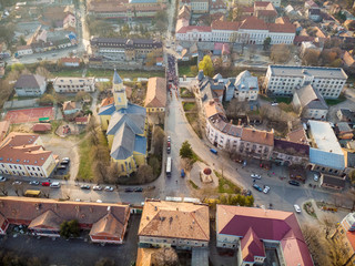 Day view from above on Beregovo. Beautiful top view of the catholic church and procession. Ukraine.