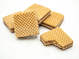 delicious hazelnut cream filled wafers on white background