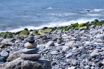 Stone tower made by tourists on the beach