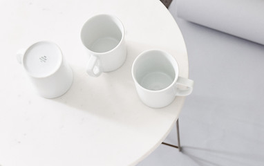 Fototapeta na wymiar white porcelain coffee mugs