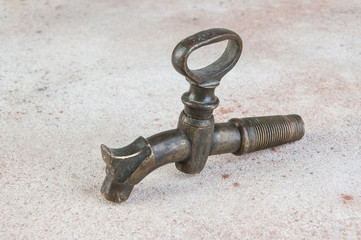 Old bronze wine barrel crane