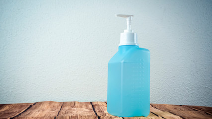 A woman is disinfecting hands rubbing with a sanitizer for corona virus prevention, hygiene to stop spreading coronavirus. Concept of early healthy hygiene learning and disease spreading prevention.