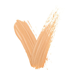 Yes tick mark sign made with face skin concealer nude color.  Brush stroke make up base creamy texture isolated on white background.