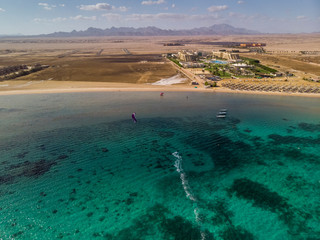 Top view of the shore of the Red Sea. Boats, boats and beautiful green water. Hurghada. Egypt.