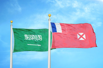 Saudi Arabia and Wallis and Futuna two flags on flagpoles and blue cloudy sky
