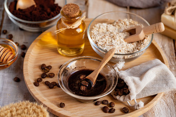 Concept of home beauty care and natural organic ingredients in cosmetology. Coffee, honey, oil, oat for gentle skin peeling and moisturizing. Health care lifestyle. Wooden background closeup