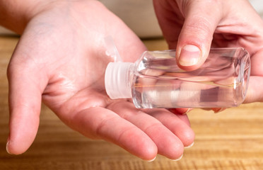 Hands Holding Hand Sanitizer