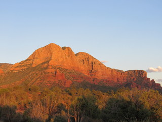 View of red rock cliffs and mountains near Sedona, Arizona at sunset 