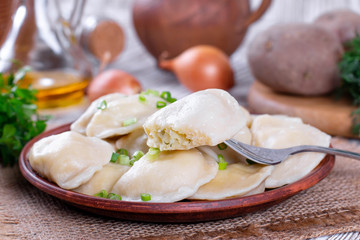 Dumplings, filled with mashed potatoes. Russian, Ukrainian or Polish dish: varenyky, vareniki