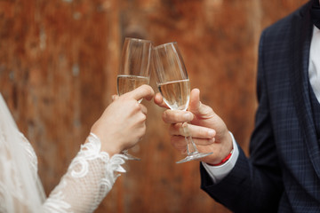 Bride and groom near the wooden doors 