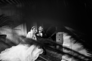 Gorgeous bride and groom near the old building  
