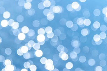 Abstract light blue background with white bokeh_