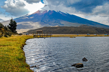 View of the Limpiopungo lagoon with the Cotopaxi volcano in the background  on a cloudy and overcast afternoon - Ecuador © alanfalcony