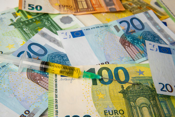 cost of coronavirus vaccine, virus in europe Euro banknotes and vaccine