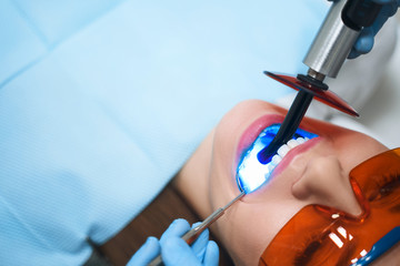 Young woman during teeth treatment stock photo