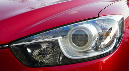 Design of a modern car. Front of the car, front headlight. Service and repair concept.