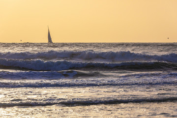 Sailboats sailing in a stormy sea