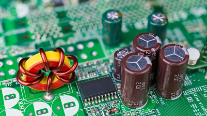 Closeup of toroidal core inductor. Passive electrical components. Electronic induction coil with...