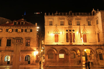 Fototapeta na wymiar Sponza palace and Clock tower in Old town of Dubrovnik, Croatia, night photograph
