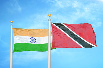 India and Trinidad and Tobago two flags on flagpoles and blue cloudy sky
