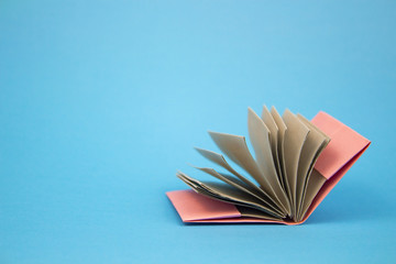 books and textbooks. book on a blue background. distance or home education. Back to school. place...