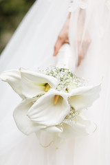 Beautiful wedding bouquet of white lilies