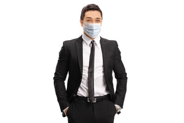 Young businessman wearing a protective medical face mask - Powered by Adobe