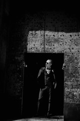 Handsome groom  in dark glasses at the street 