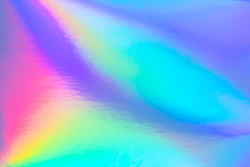 Abstract trendy rainbow holographic background in 80s style. Blurred texture in violet, pink and...