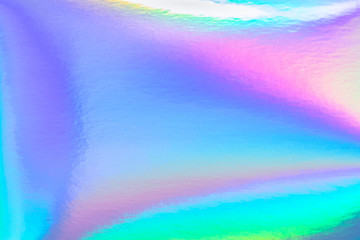 Abstract trendy rainbow holographic background in 80s style. Blurred texture in violet, pink and...