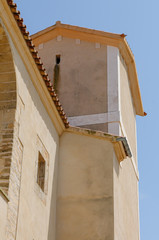 Fototapeta na wymiar Roof and tower of the church at Santuari de Sant Salvador, Arta, Mallorca/Majorca