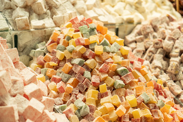 Assorted Turkish delight. Traditional candy for feast of ramadan and feast of sacrifice. Delicious and tasty desserts with chocolate, pistachio, fruit, walnut, hazelnut.