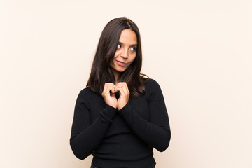 Young brunette woman with white sweater over isolated background scheming something